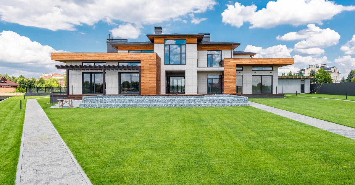 Recommendation for web-site aggregating accommodation in New York - Exterior of modern house with glass doors and panoramic windows Recommendation for web-site aggregating accommodation in New York - Exterior of modern house with glass doors and panoramic windows