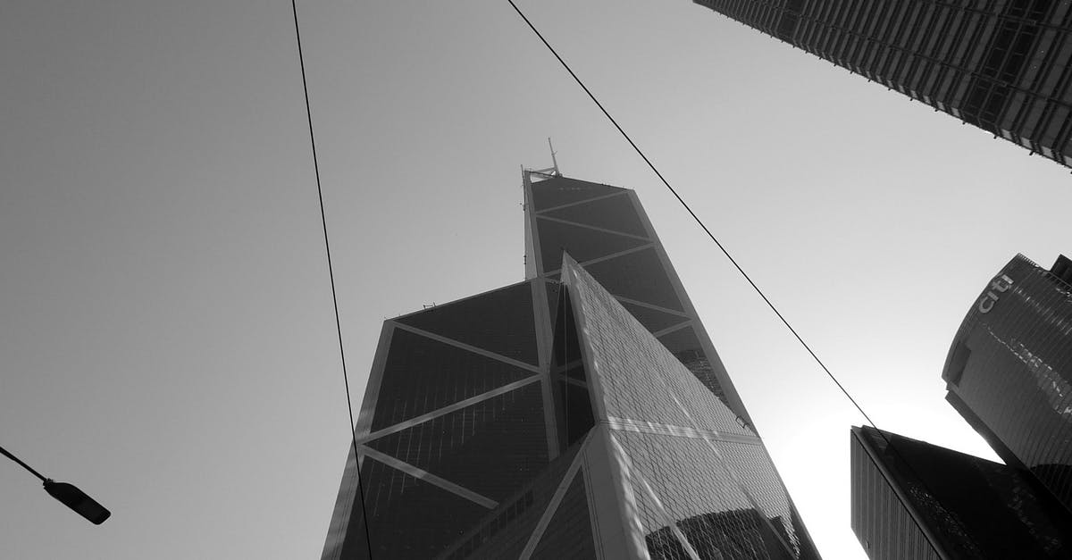 Recourse against bank ATM fraud in China - Futuristic skyscrapers with glass facades under cloudless sky Recourse against bank ATM fraud in China - Futuristic skyscrapers with glass facades under cloudless sky