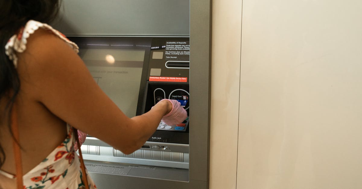 Recourse against bank ATM fraud in China - Woman Using An Automated Teller Machine Recourse against bank ATM fraud in China - Woman Using An Automated Teller Machine