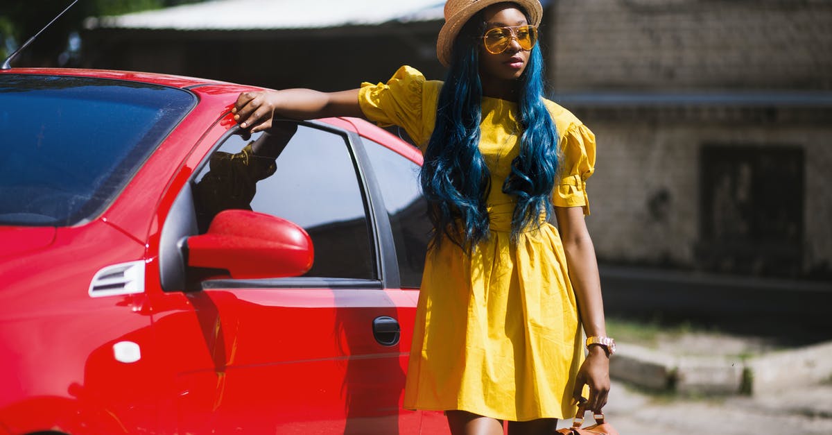 Red triangle, yellow jackets, etc. for rental cars in France - Woman Standing Beside Red Car Red triangle, yellow jackets, etc. for rental cars in France - Woman Standing Beside Red Car
