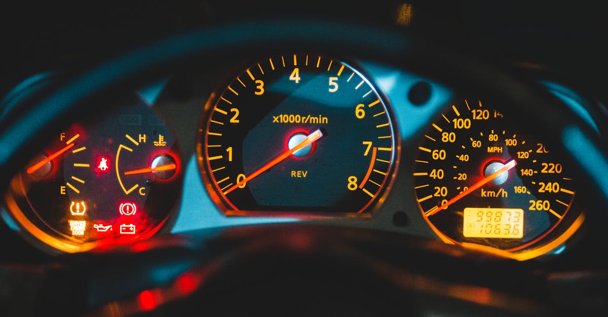 Red triangle, yellow jackets, etc. for rental cars in France - Closeup of tachometer near speedometer and oil pressure gauge on colorful dashboard in modern car Red triangle, yellow jackets, etc. for rental cars in France - Closeup of tachometer near speedometer and oil pressure gauge on colorful dashboard in modern car