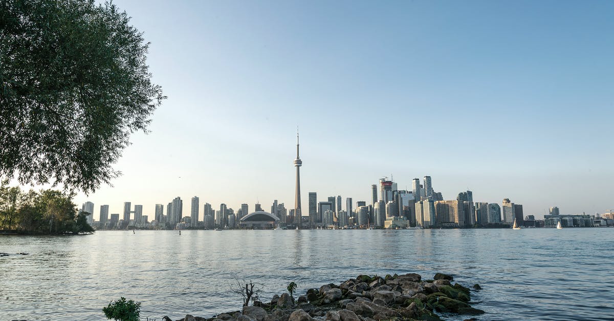 Re-enter USA from Canada with Visa Waiver Program - City Skyline Across Body of Water Re-enter USA from Canada with Visa Waiver Program - City Skyline Across Body of Water