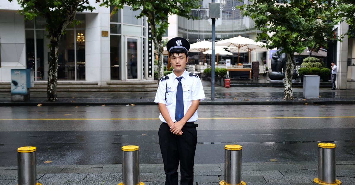 Re-entering Canada after minor contact with the police there - Man Standing Near Road Re-entering Canada after minor contact with the police there - Man Standing Near Road