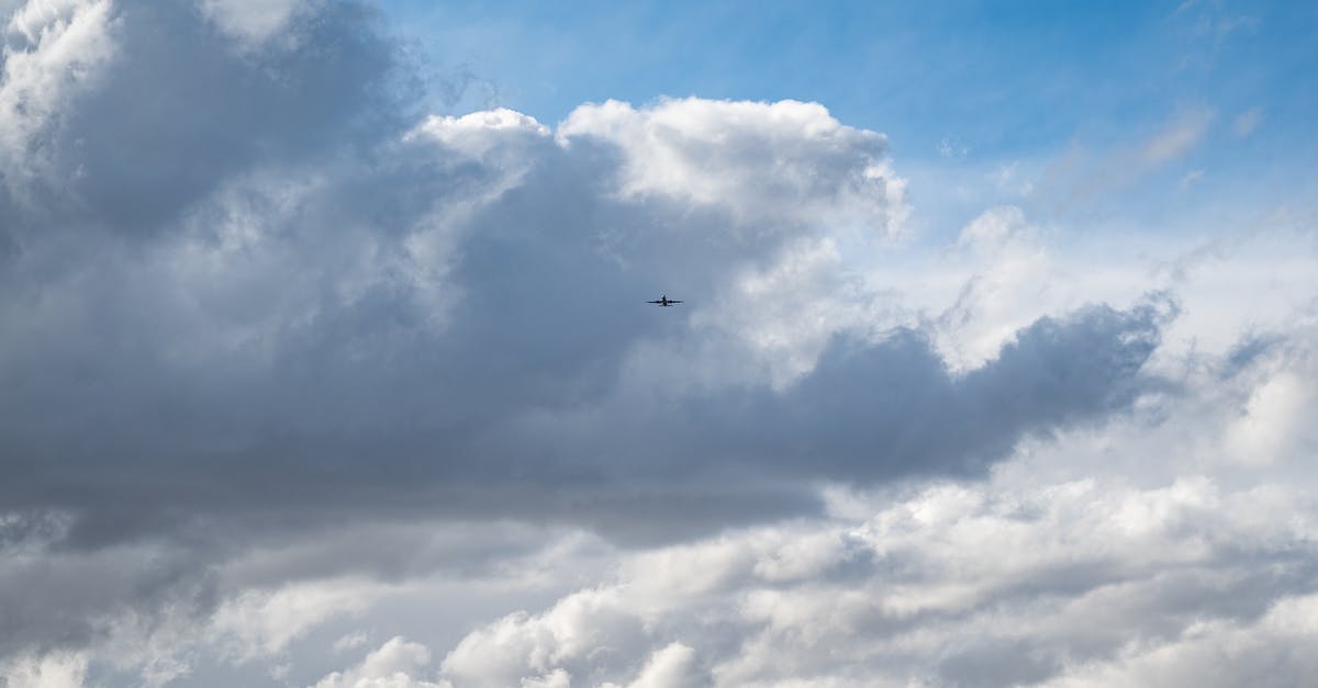 Refund/ compenastion for cancelled Air China international flight - Plane flying over clouds in blue sky Refund/ compenastion for cancelled Air China international flight - Plane flying over clouds in blue sky