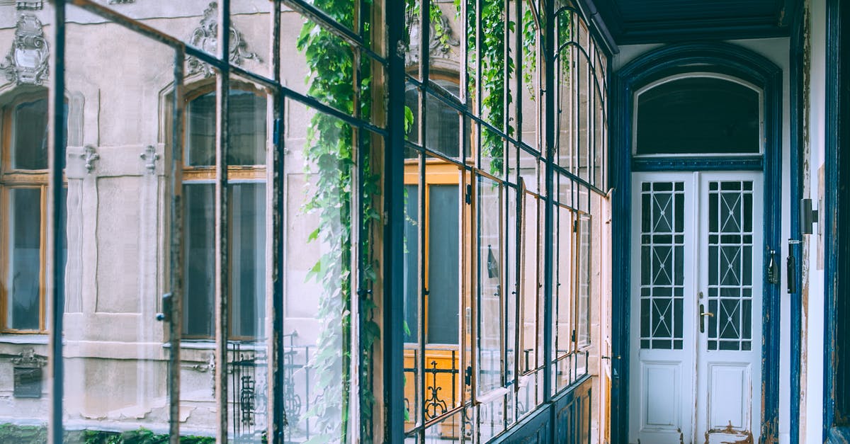 Refused entry to UK, not sure what to do - Entrance of old building with glass wall Refused entry to UK, not sure what to do - Entrance of old building with glass wall
