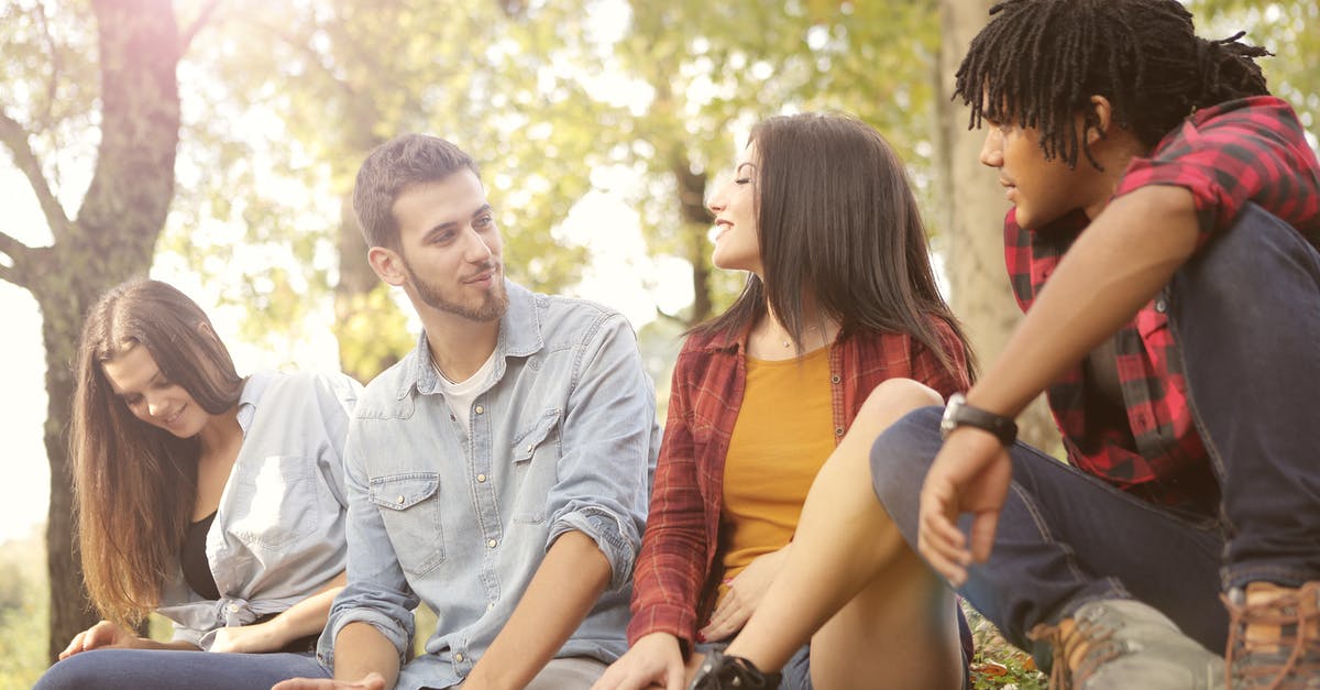 Refused Entry to UK. Will this affect my Student Visa application? - From below of diverse young people in casual clothes sitting on grass and talking Refused Entry to UK. Will this affect my Student Visa application? - From below of diverse young people in casual clothes sitting on grass and talking