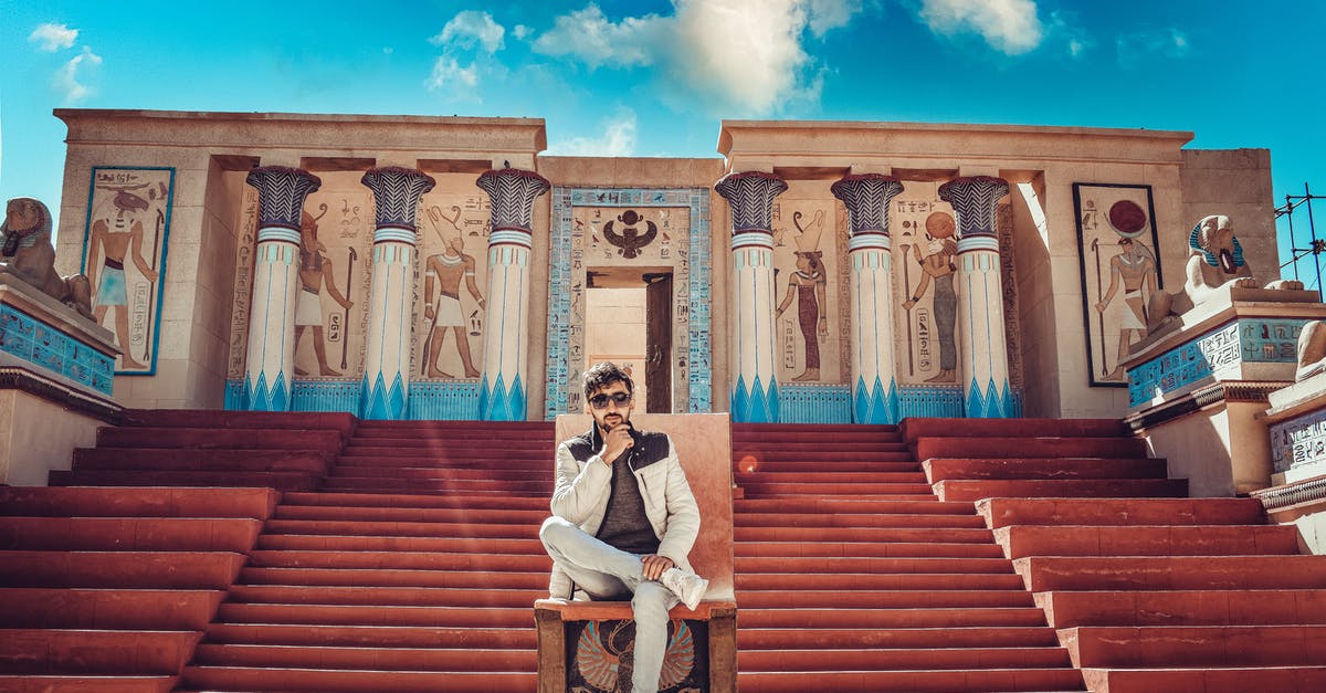 Regarding new rules for getting a tourist visa for Egypt - Man in White Dress Shirt and Black Pants Sitting on Brown Concrete Stairs Regarding new rules for getting a tourist visa for Egypt - Man in White Dress Shirt and Black Pants Sitting on Brown Concrete Stairs