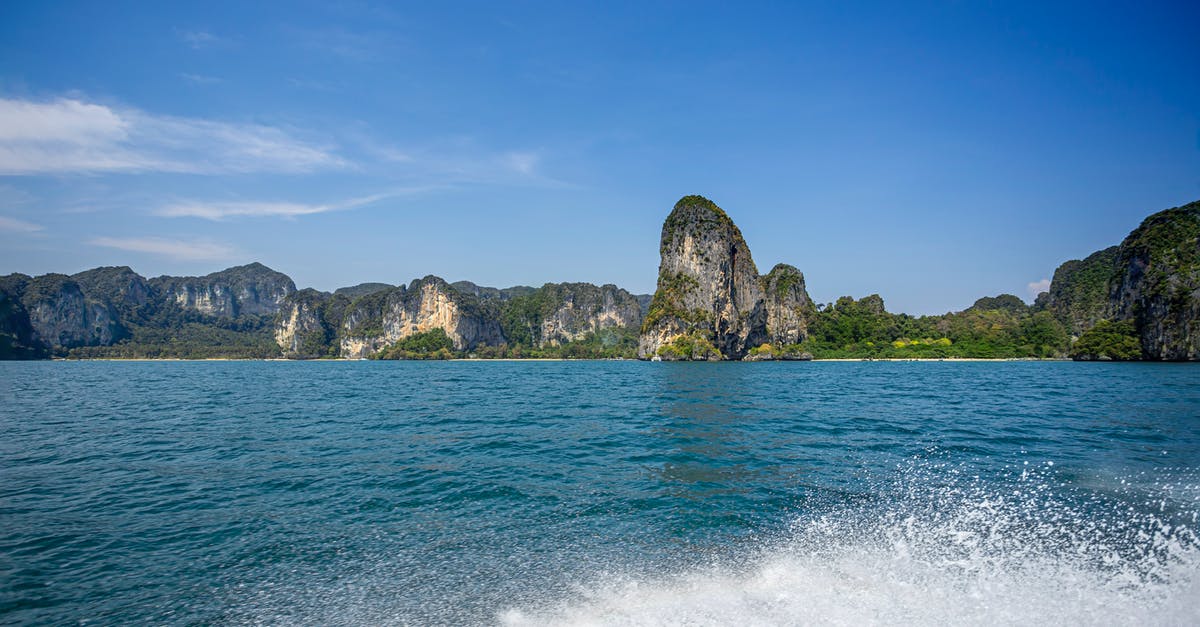 Regarding transit visa for Thailand - Green and Brown Island on Blue Sea Under Blue Sky Regarding transit visa for Thailand - Green and Brown Island on Blue Sea Under Blue Sky