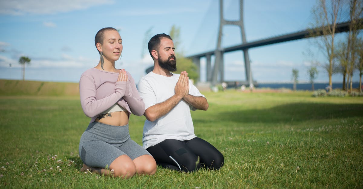 Rejection of UK visa got an entire delegation coming for University-sponsored one-week training [closed] - A Couple Meditating on the Grass Field