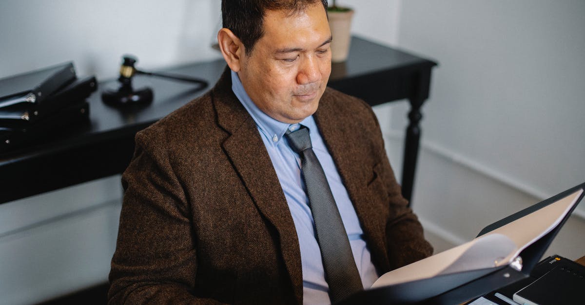Reliability data for German trains - Pensive Asian lawyer examining report in office Reliability data for German trains - Pensive Asian lawyer examining report in office