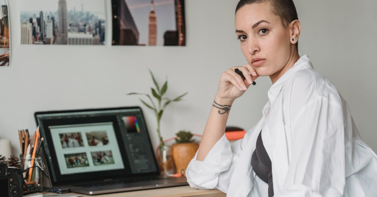 Remote independent contractor needs short onsite training in US - what is the Visa requirement? - Thoughtful woman with stylus working with photos on laptop Remote independent contractor needs short onsite training in US - what is the Visa requirement? - Thoughtful woman with stylus working with photos on laptop