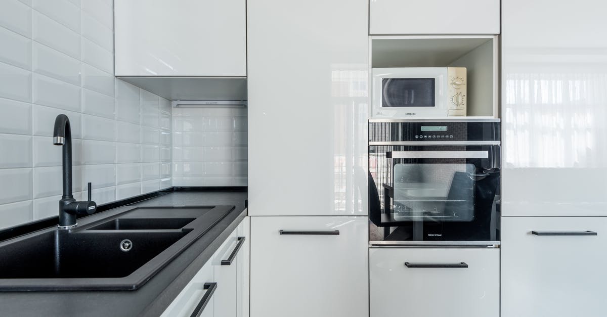 Renewing passport in India and coming back to the USA with new renewed passport? - Modern white kitchen with black sink and oven Renewing passport in India and coming back to the USA with new renewed passport? - Modern white kitchen with black sink and oven