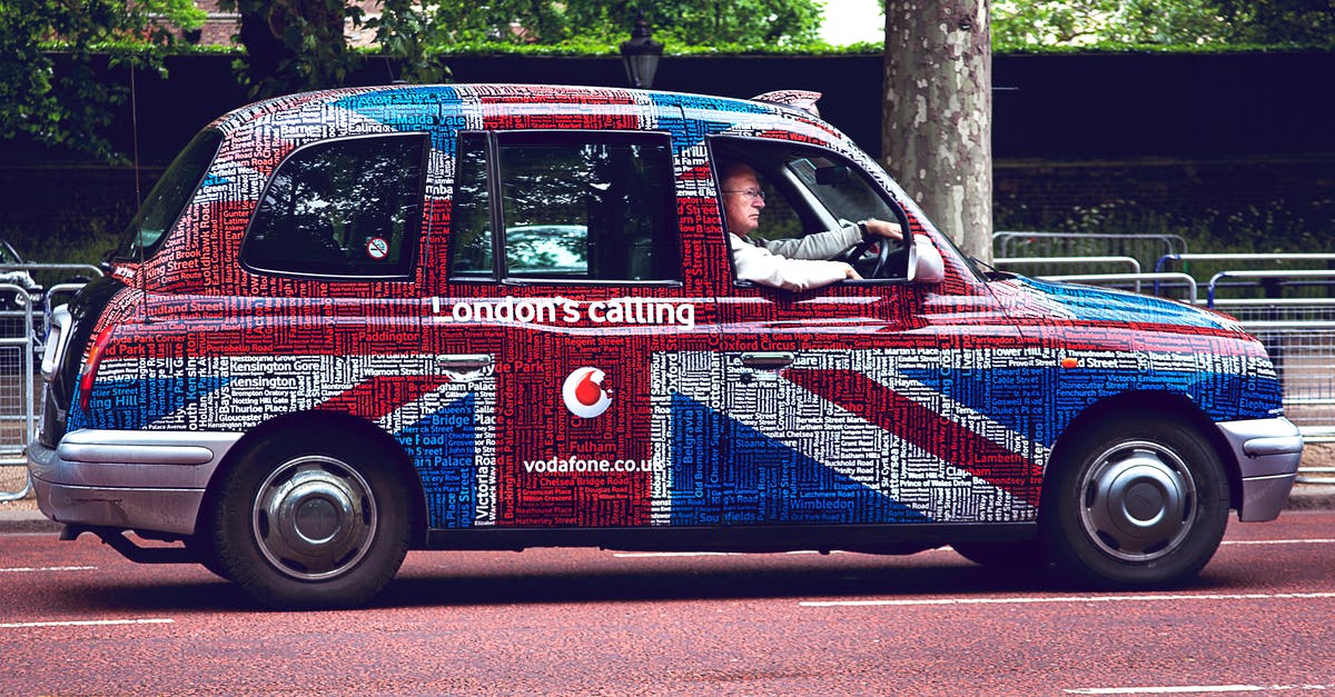 Rental car insurance in the UK - Man Driving Vehicle Near Tree Rental car insurance in the UK - Man Driving Vehicle Near Tree