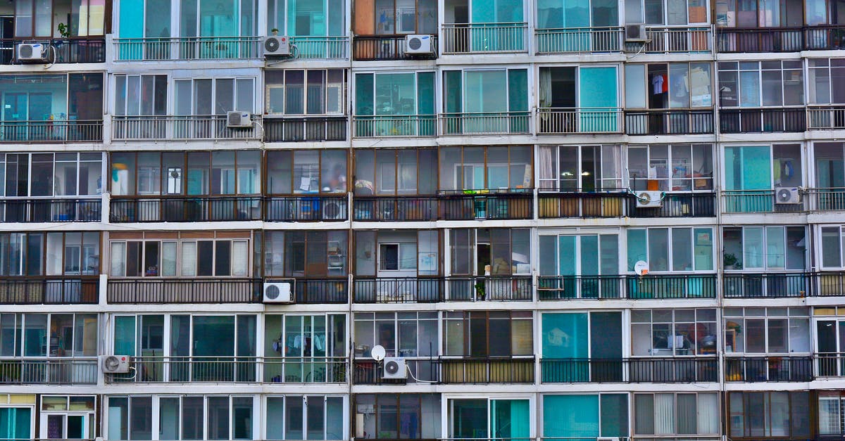 Renting a flat in Lille for a few months - options beyond Air BnB? - Facade of contemporary residential multistage house with many apartments representing fenced terraces and windows near outdoor air conditioning units in town in daylight Renting a flat in Lille for a few months - options beyond Air BnB? - Facade of contemporary residential multistage house with many apartments representing fenced terraces and windows near outdoor air conditioning units in town in daylight