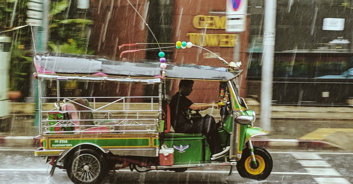Renting a motorcycle in Thailand - Person Driving A Motorcycle Renting a motorcycle in Thailand - Person Driving A Motorcycle