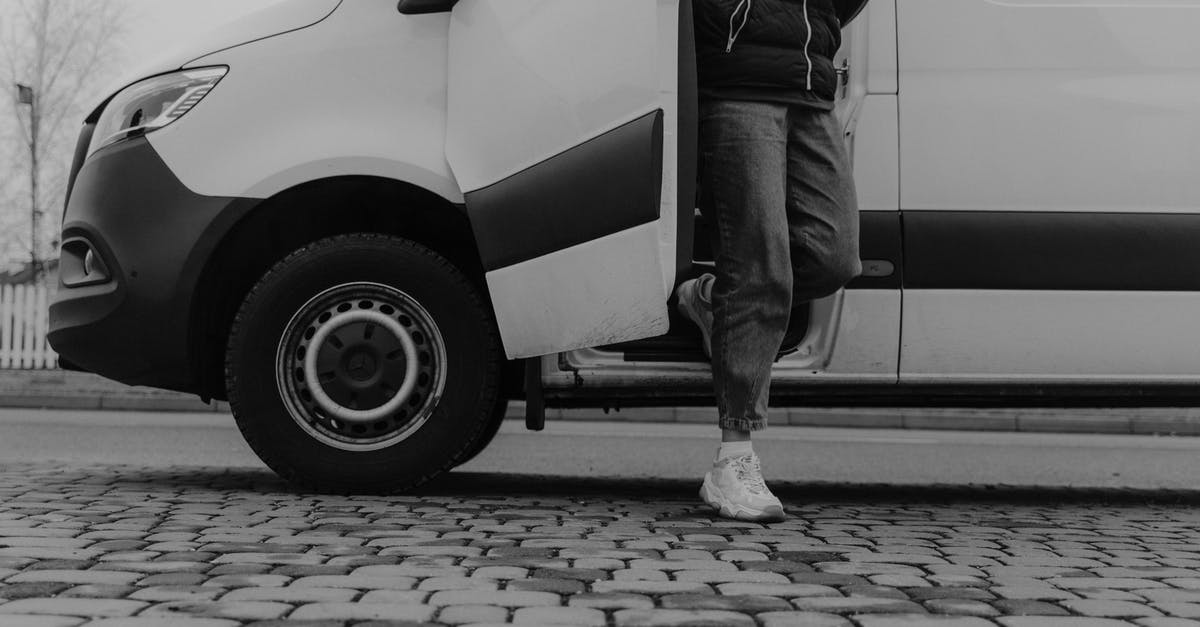 Renting a van out of Geneva airport - Grayscale Photo of a Man Getting Out of the Vehicle Renting a van out of Geneva airport - Grayscale Photo of a Man Getting Out of the Vehicle