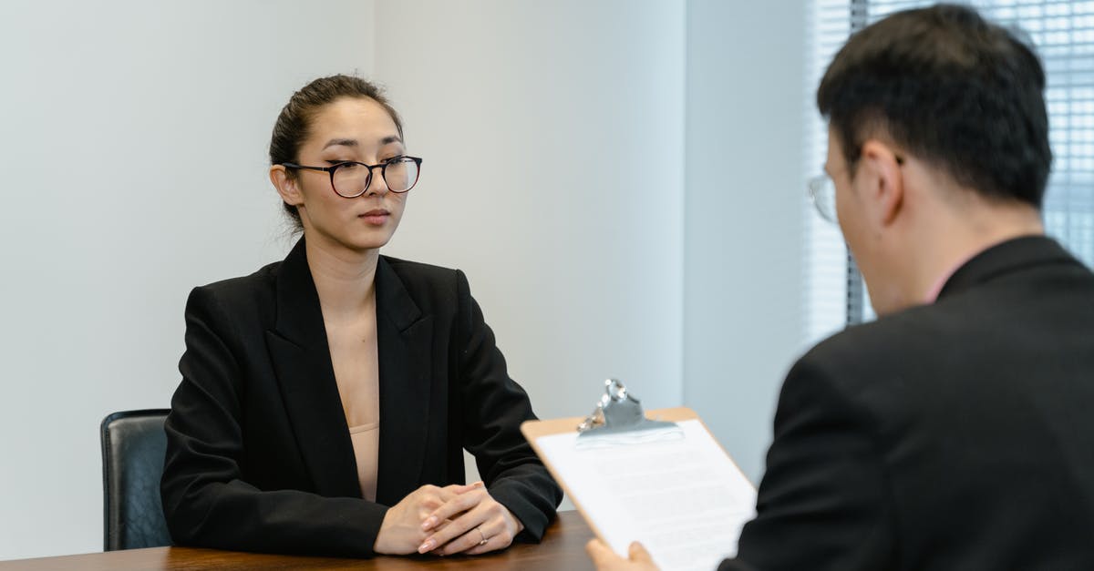Reporting a cancelled visa - Colleagues in a Meeting Reporting a cancelled visa - Colleagues in a Meeting