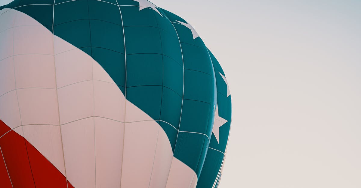 Reschedule a flight on Eva Air after original flight has departed [closed] - Blue, White, and Red Hot Air Balloon