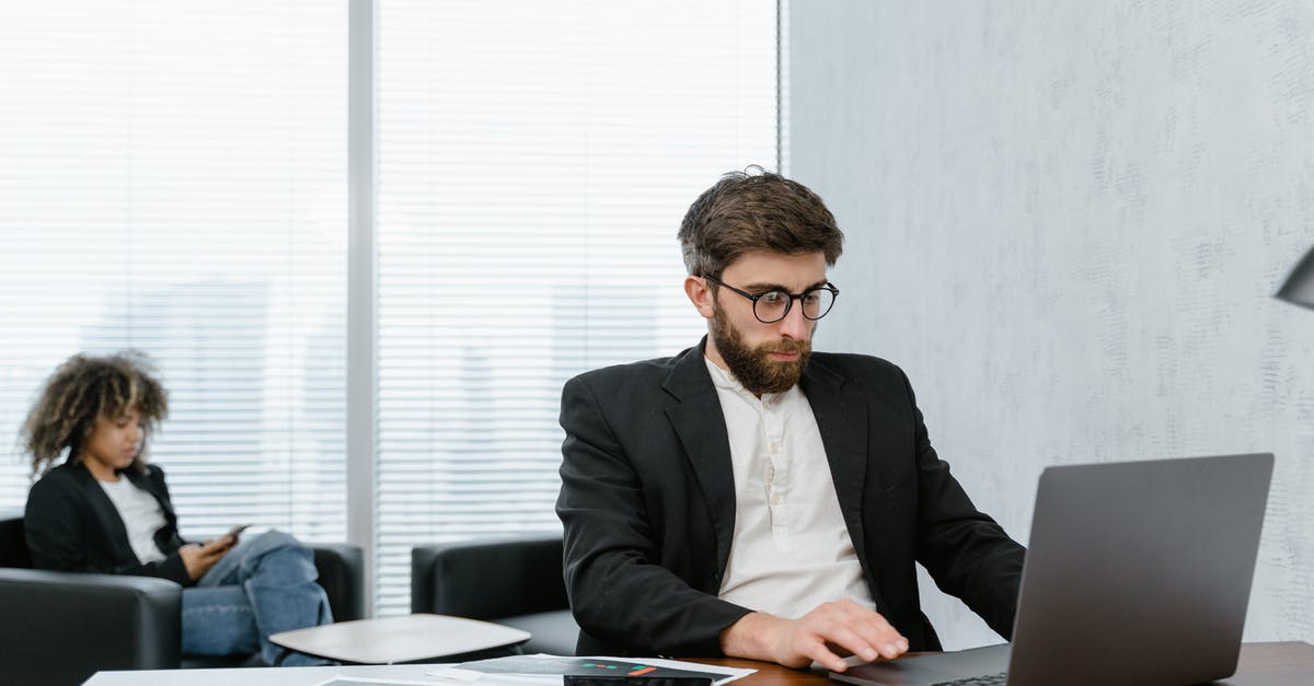 Reservation is trying to change the price of a room - Man in Black Suit Jacket Using Macbook Pro Reservation is trying to change the price of a room - Man in Black Suit Jacket Using Macbook Pro