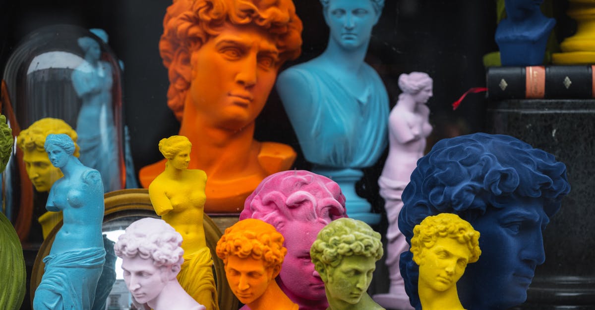 Retroactively claim miles in different alliances? - Multicolored head sculptures of David near bright statuettes placed in store with abundance of souvenirs and black pillar with book Retroactively claim miles in different alliances? - Multicolored head sculptures of David near bright statuettes placed in store with abundance of souvenirs and black pillar with book