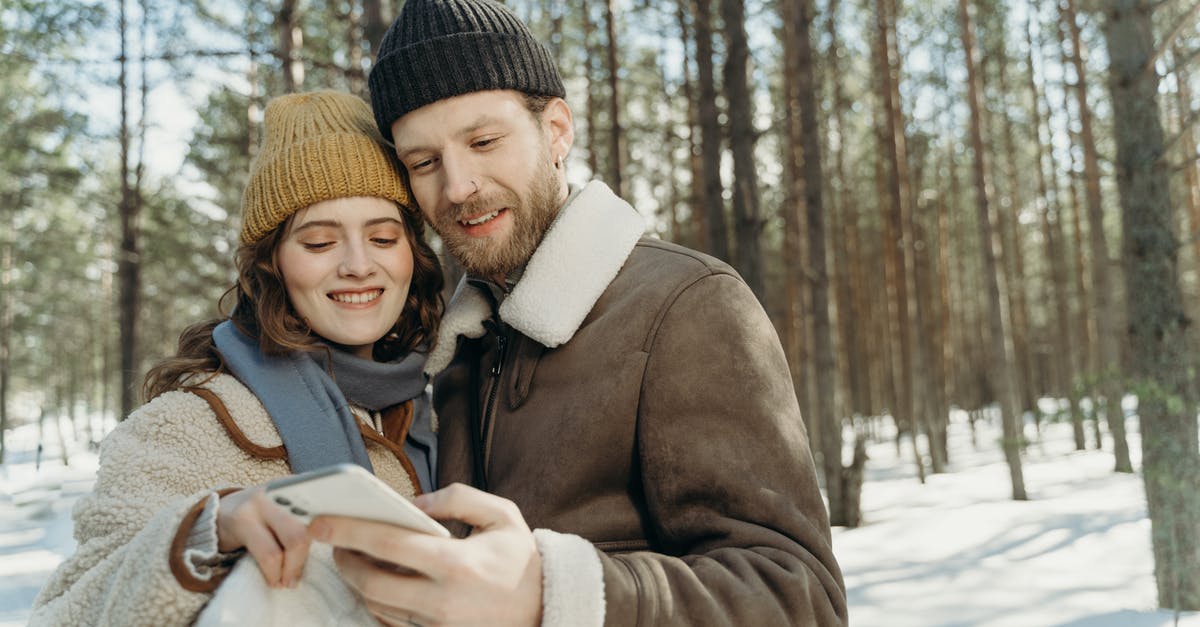 Revealing relationship on German visa application - Man in Brown Coat Carrying Baby in White and Black Coat Revealing relationship on German visa application - Man in Brown Coat Carrying Baby in White and Black Coat