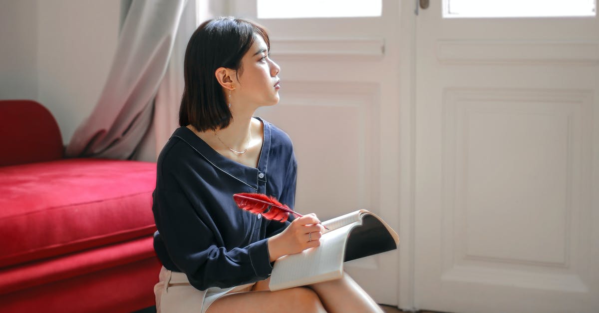 Re-visiting the UK alone with the EU national family visa - Thoughtful woman writing in notebook at home Re-visiting the UK alone with the EU national family visa - Thoughtful woman writing in notebook at home