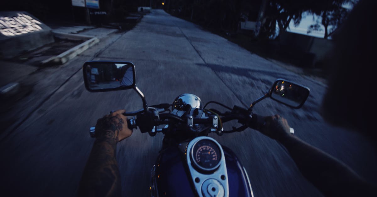 Riding an Abra at Night (Dubai) - Person Riding Motorcycle on Road during Night Time Riding an Abra at Night (Dubai) - Person Riding Motorcycle on Road during Night Time