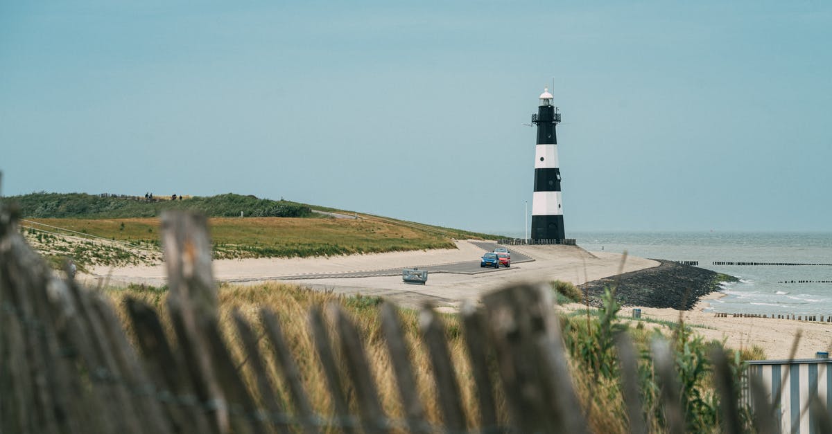 Roadtrip coast to coast in the USA, let someone else drive car back - Solitude lighthouse on coastline at sea Roadtrip coast to coast in the USA, let someone else drive car back - Solitude lighthouse on coastline at sea