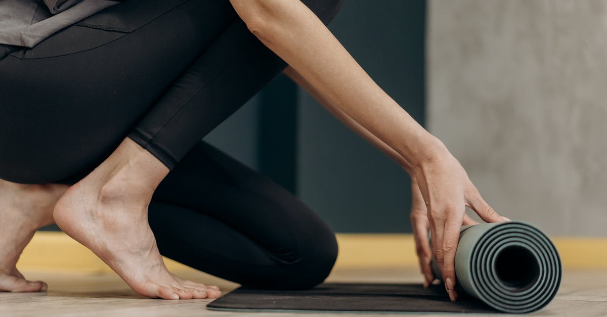 Rolling blackouts in the Philippines - Woman Unrolling A Yoga Mat Rolling blackouts in the Philippines - Woman Unrolling A Yoga Mat