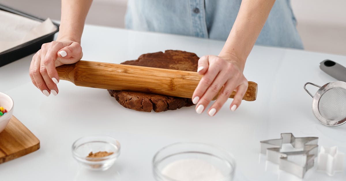 Rolling shirts in a bundle VS laying them flat while packing? - Person Flattening a Chocolate Dough With Rolling Pin Rolling shirts in a bundle VS laying them flat while packing? - Person Flattening a Chocolate Dough With Rolling Pin