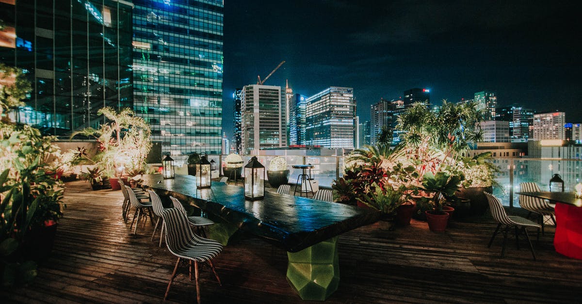 Rooftop restaurant in Santiago, Chile - View Of The Cityscape From A Rooftop Garden Restaurant At Night Rooftop restaurant in Santiago, Chile - View Of The Cityscape From A Rooftop Garden Restaurant At Night