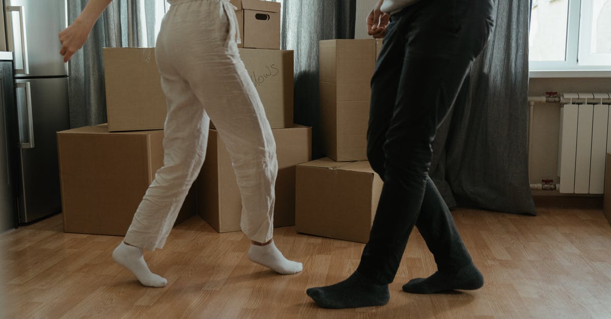 Rooms to let in Greece during beginning of July - Man in White T-shirt and Black Pants Holding Woman in White T-shirt Rooms to let in Greece during beginning of July - Man in White T-shirt and Black Pants Holding Woman in White T-shirt