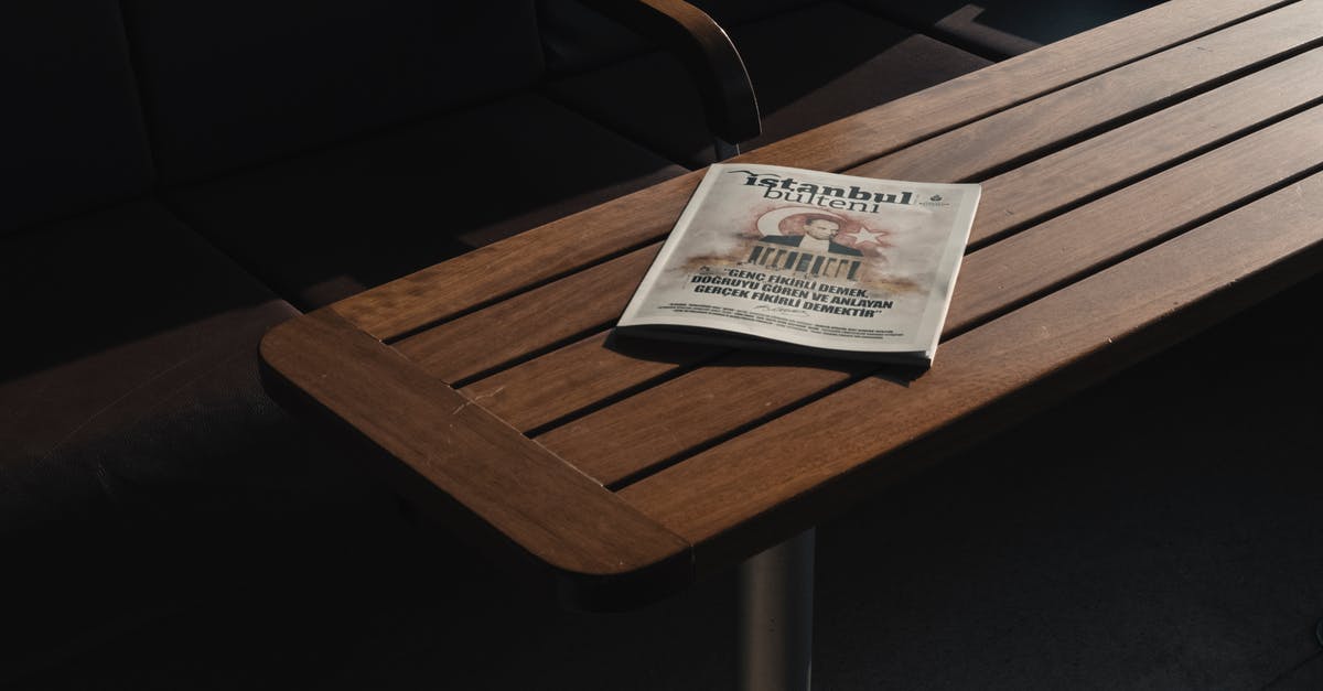 Russia roadmap with information on the surface - From above of empty dark chairs and closed book about Turkey placed on wooden dark brown table Russia roadmap with information on the surface - From above of empty dark chairs and closed book about Turkey placed on wooden dark brown table