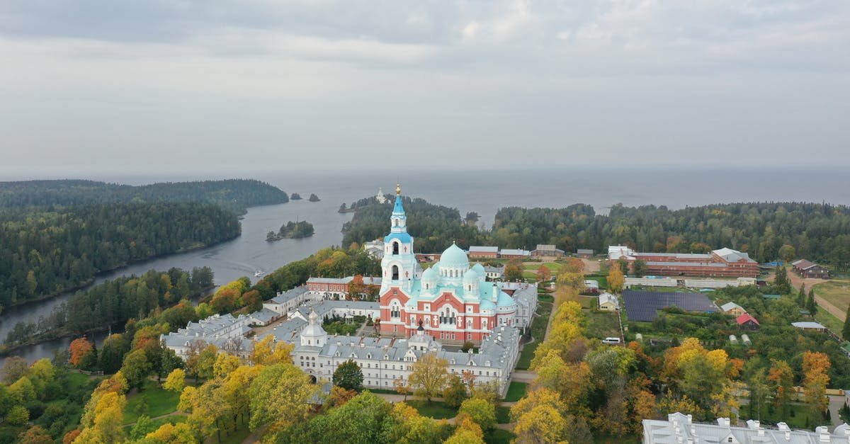 Russia visa application: no surname to fill in - White and Red Concrete Building Surrounded by Green Trees Under White Clouds Russia visa application: no surname to fill in - White and Red Concrete Building Surrounded by Green Trees Under White Clouds