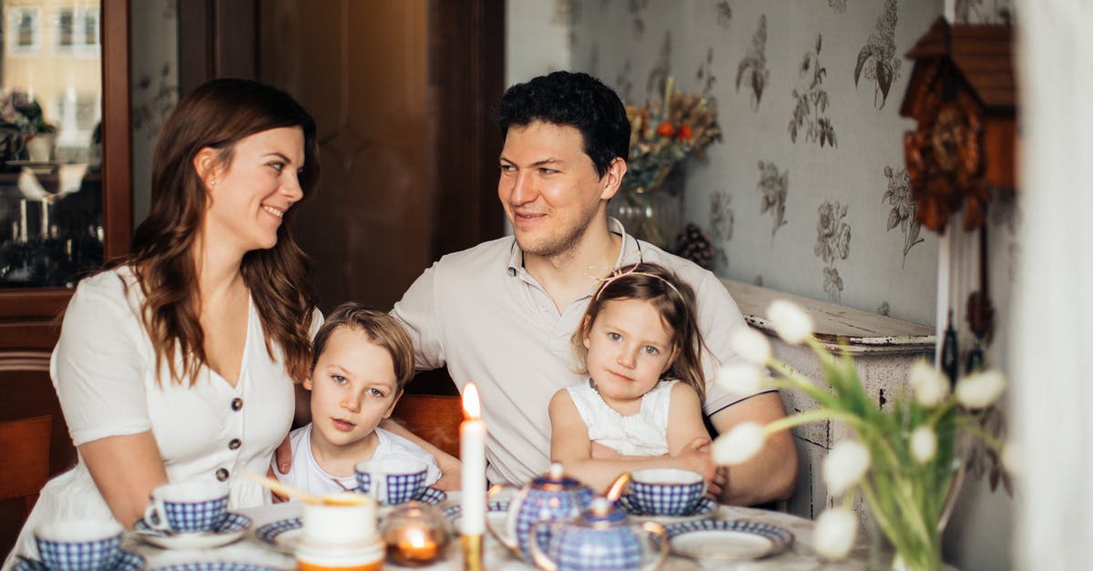 Russian mom traveling from US to Russian Federation with little kid [closed] - Family Sitting at Table