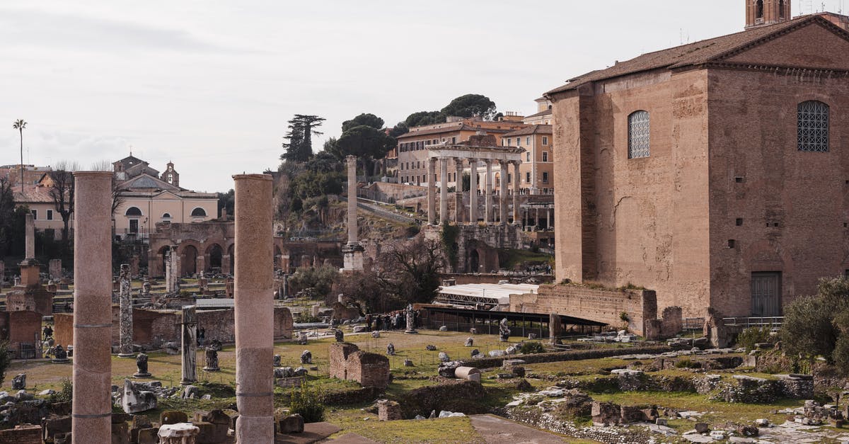 Russian National with permanent Italian Residence card going to Curacao - Roman Forum with old building facades and columns in city Russian National with permanent Italian Residence card going to Curacao - Roman Forum with old building facades and columns in city
