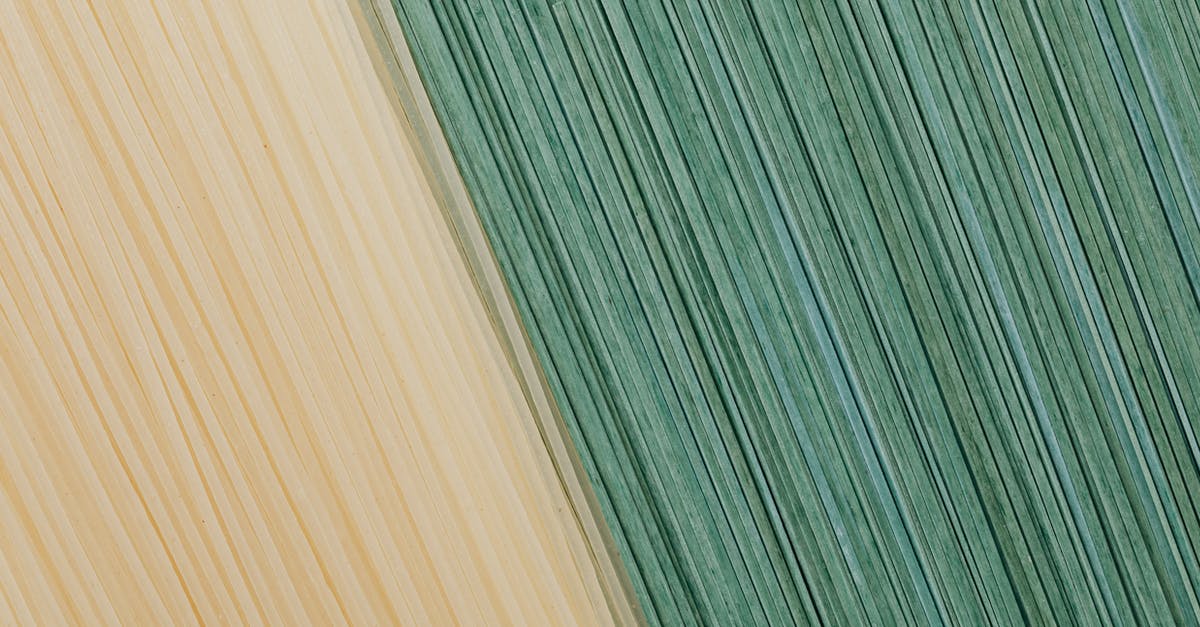 Russian National with permanent Italian Residence card going to Curacao - Yellow and green food background from dry pasta Russian National with permanent Italian Residence card going to Curacao - Yellow and green food background from dry pasta