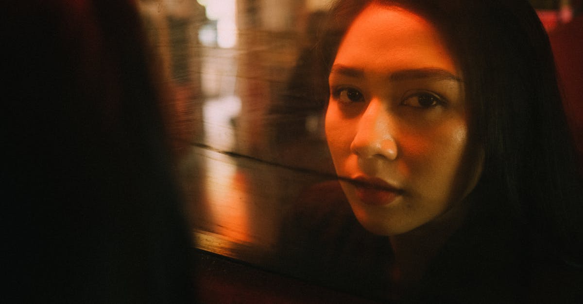 Russian visa goes in effect at what time? - Content ethnic female reflecting in glass window and looking at camera in cozy cafe Russian visa goes in effect at what time? - Content ethnic female reflecting in glass window and looking at camera in cozy cafe