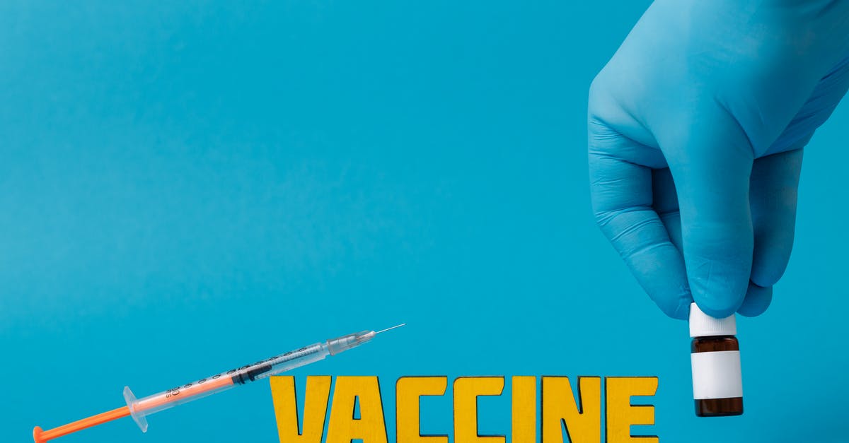 Rwanda: Yellow fever vaccination required? - Covid Vaccine on Blue Surface Rwanda: Yellow fever vaccination required? - Covid Vaccine on Blue Surface