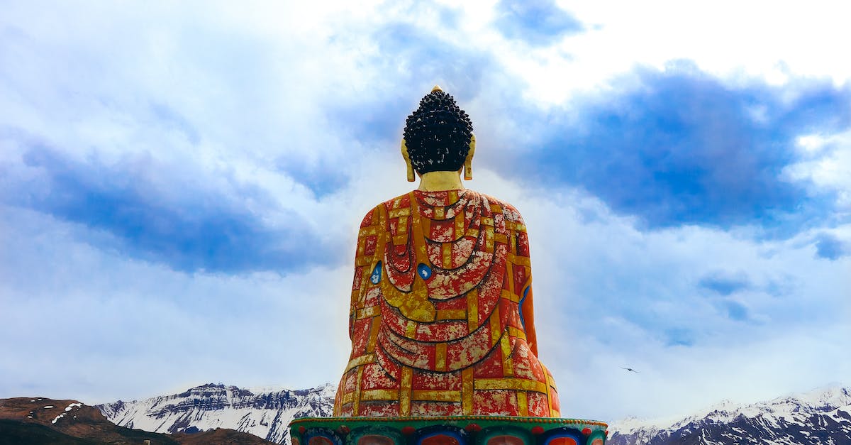 Sacred mountains in Japan? - Back View of a Buddha Statue Sacred mountains in Japan? - Back View of a Buddha Statue