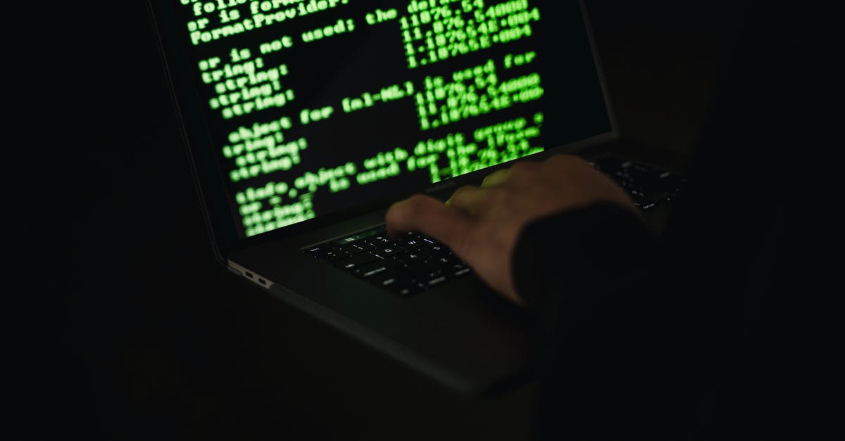 Safety: What data is available on crime in NYC in 2013? - Crop hacker typing on laptop with information on screen Safety: What data is available on crime in NYC in 2013? - Crop hacker typing on laptop with information on screen