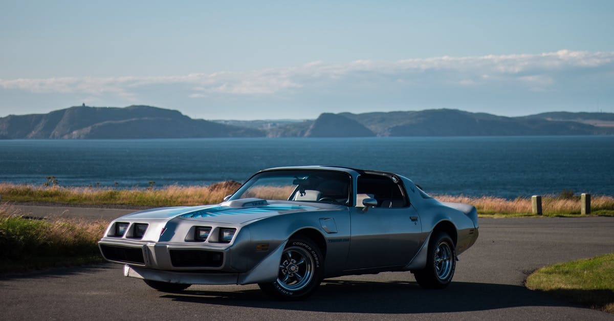 Salt Lake City, UT to Phoenix, AZ - Which route is less mountainous? - Old luxury retro sports car parked on even asphalt road near shoreline of big lake and mountain range under light blue sky Salt Lake City, UT to Phoenix, AZ - Which route is less mountainous? - Old luxury retro sports car parked on even asphalt road near shoreline of big lake and mountain range under light blue sky
