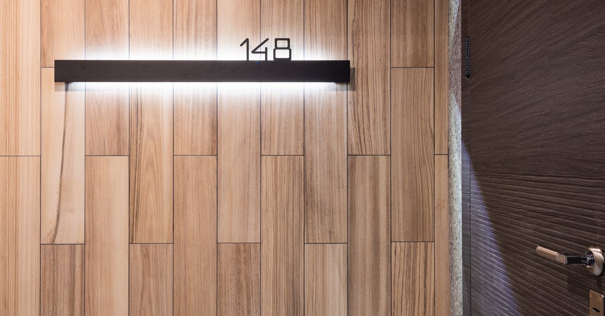 Same Global Entry membership/PASSID number for husband and wife? - Number of hotel room on wall