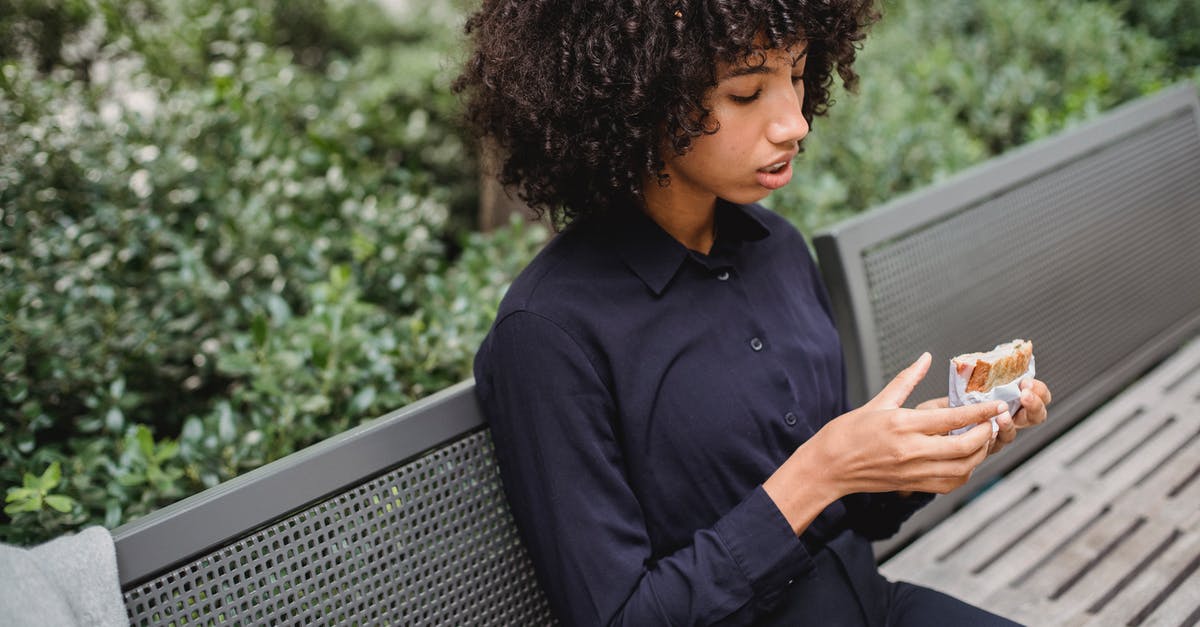 Sandwich alternatives for city trips - Crop African American woman having snack Sandwich alternatives for city trips - Crop African American woman having snack