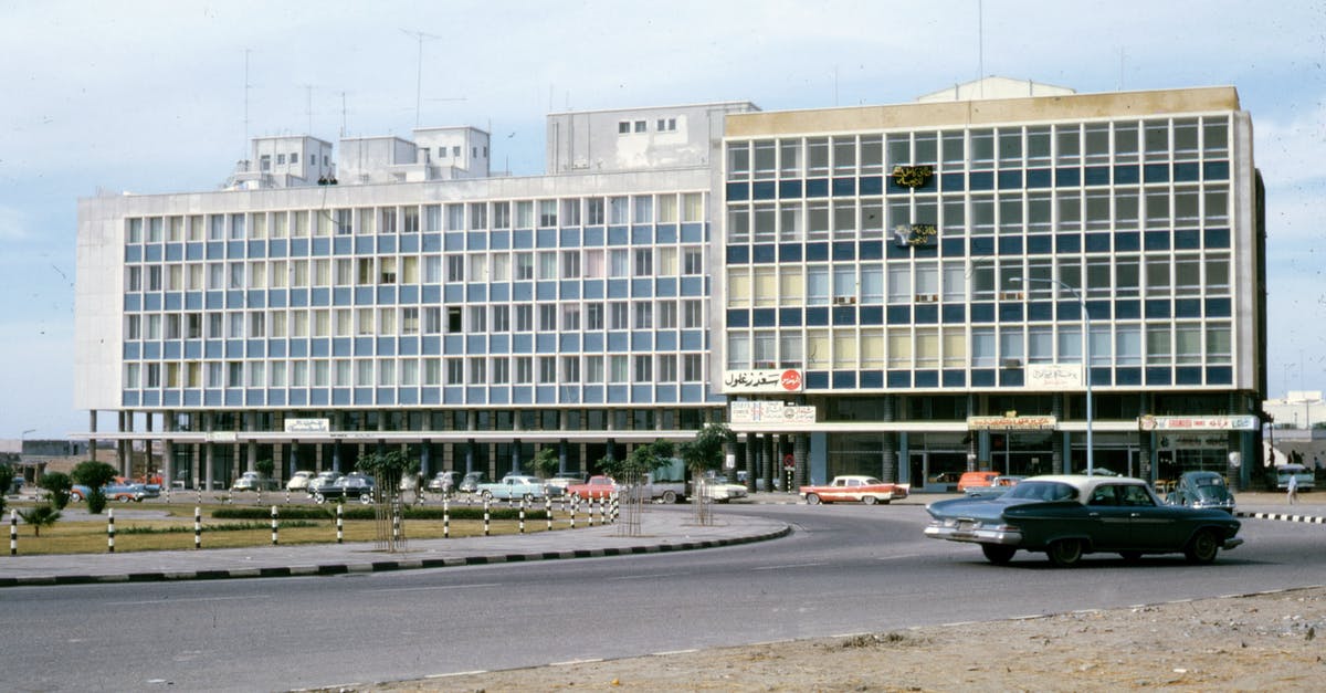 Saudi Arabia Transit Visa - Old Photo of White Concrete Building Saudi Arabia Transit Visa - Old Photo of White Concrete Building
