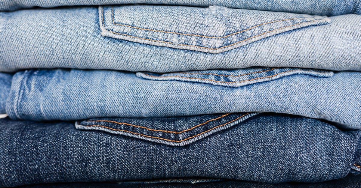 Scaffoldings in New York [closed] - Closeup of stack of blue denim pants neatly arranged according to color from lightest to darkest