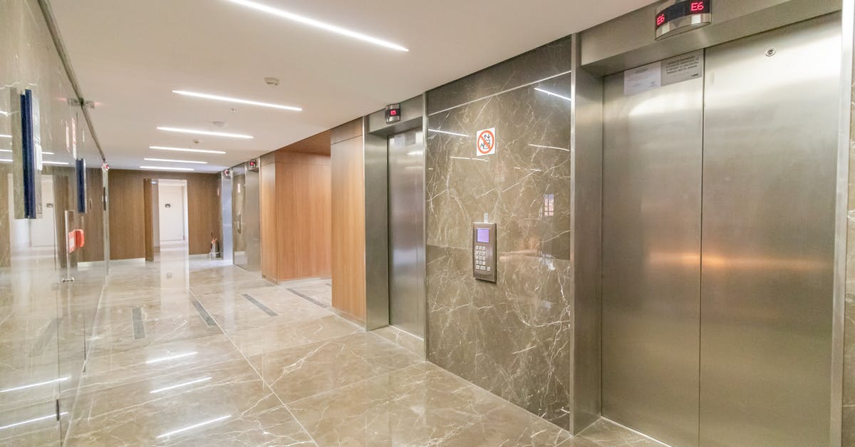 Schengen area entry point rules when no visa is needed [duplicate] - Corridor of modern building with elevators
