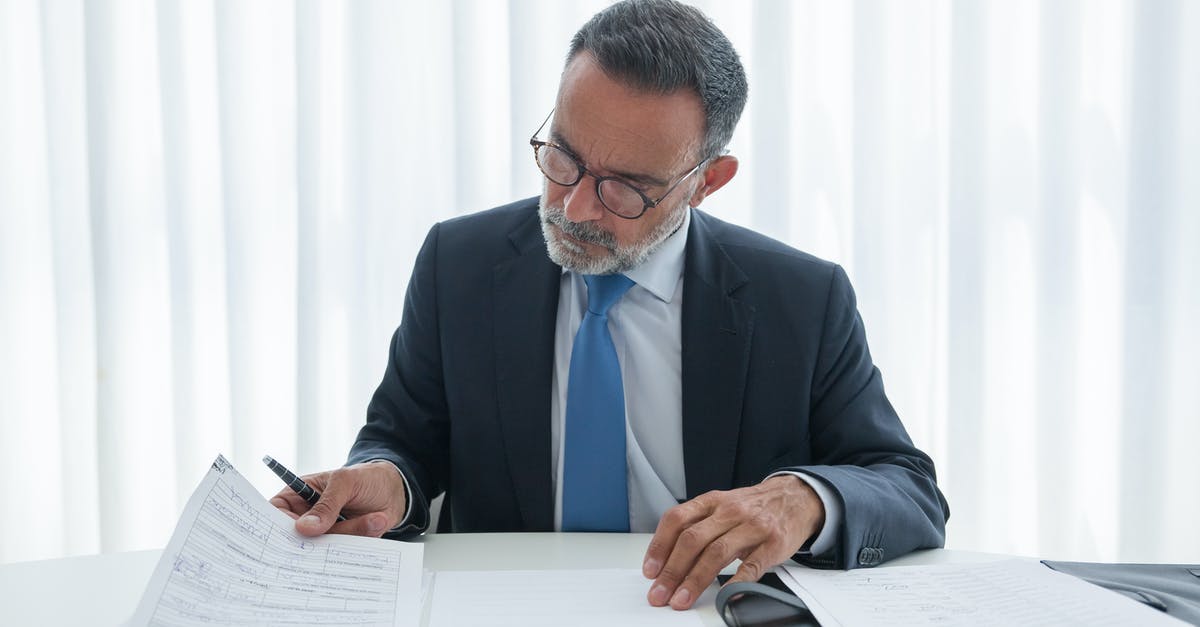 Schengen business visa for a recent graduate - Man in Black Suit Jacket Wearing Blue Necktie and Blue Necktie Writing on White Paper Schengen business visa for a recent graduate - Man in Black Suit Jacket Wearing Blue Necktie and Blue Necktie Writing on White Paper