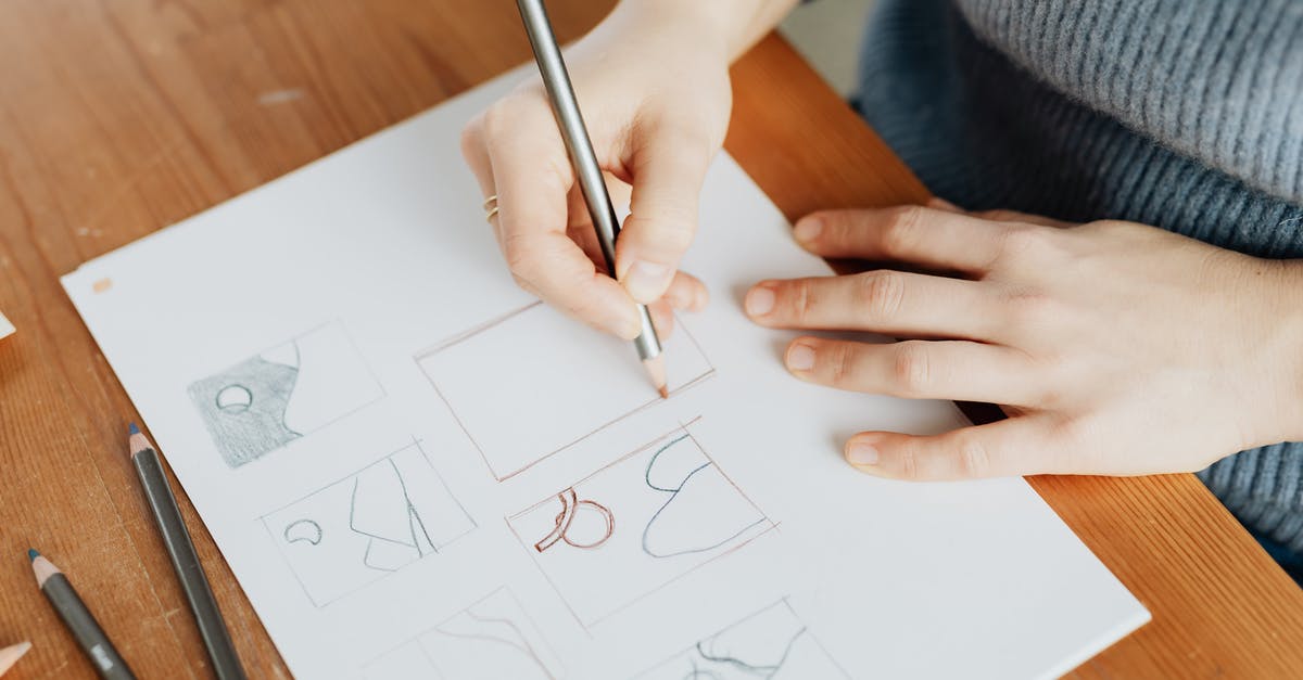 Schengen itinerary different from initially planned [duplicate] - From above of faceless female designer in knitted sweater sitting at wooden table with sheet of paper while drawing with pencil