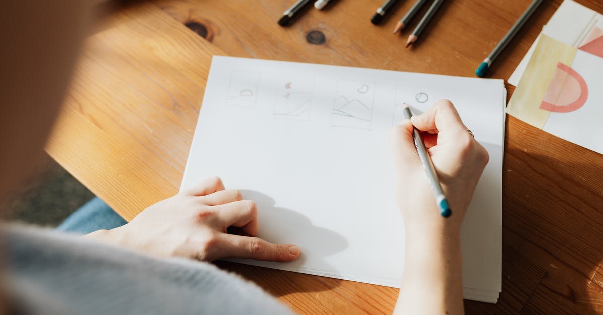 Schengen itinerary different from initially planned [duplicate] - From above of crop faceless female designer in casual clothes creating scheme on sheet of paper with pencil while sitting at wooden desk in sunlight